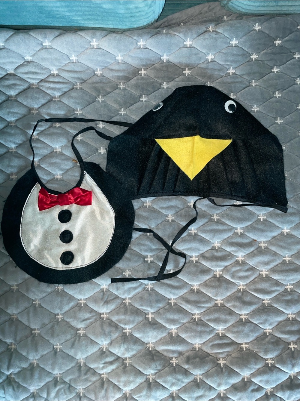 Two handmade penguin costume pieces for a toddler
